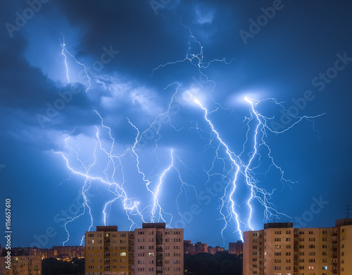 Photography Many Lightnings Over Housing Estate. Night Storm in the City.
