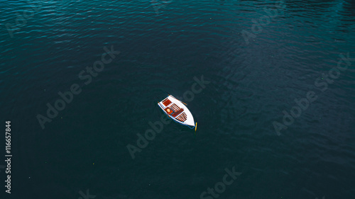 boat on water with red vivid color