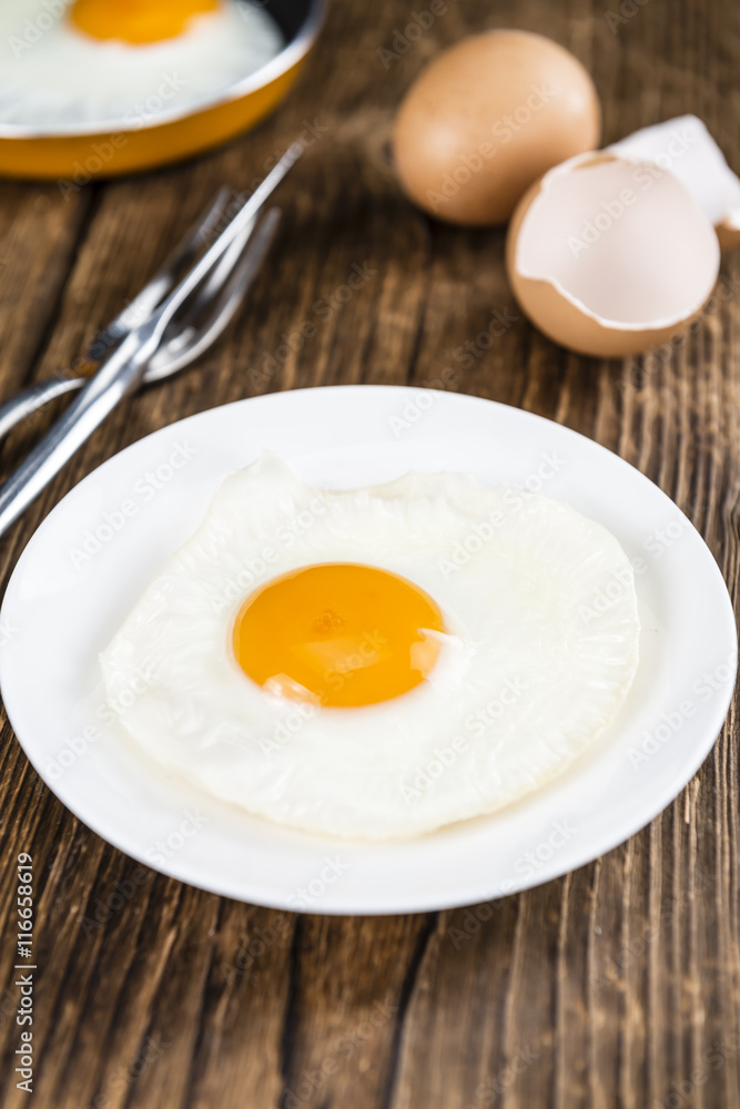 Fried Eggs on wooden background Fried Eggs on wooden background