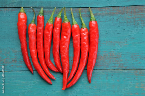 Flat lay view of hot red chili peppers