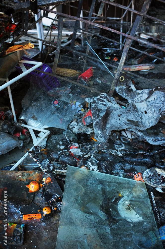 Bali, Indonesia - March 25, 2016: Fire damage after a serious blaze caused by an electrical short-circuit razed a popular tourist market in Ubud, Bali, Indonesia. Bali, Indonesia - March 25, 2016: Fire damage after a serious blaze caused by an electrical short-circuit razed a popular tourist market in Ubud, Bali, Indonesia.