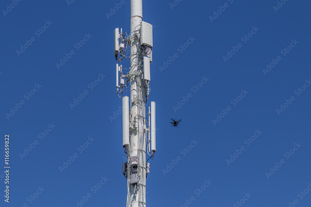 Drone inspecting right side of a cell tower