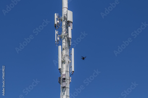 Drone inspecting right side of a cell tower