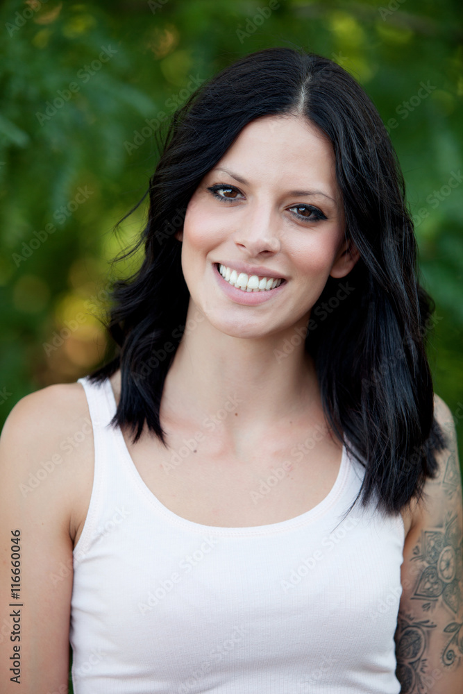 Beautiful brunette girl relaxing in the park Beautiful brunette girl relaxing in the park