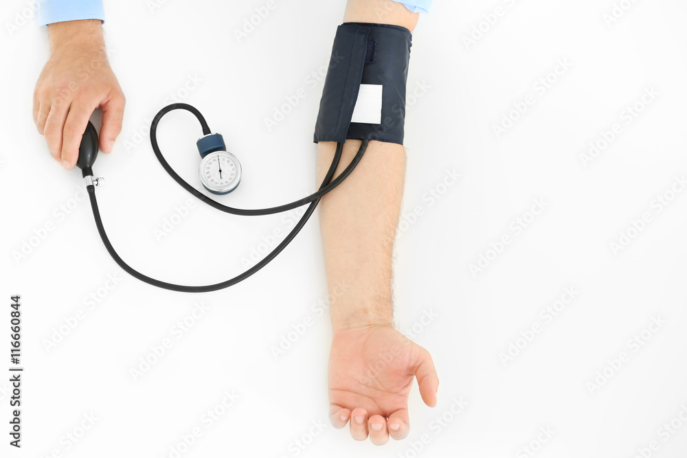 Male hands with tonometer on white background Male hands with tonometer on white background