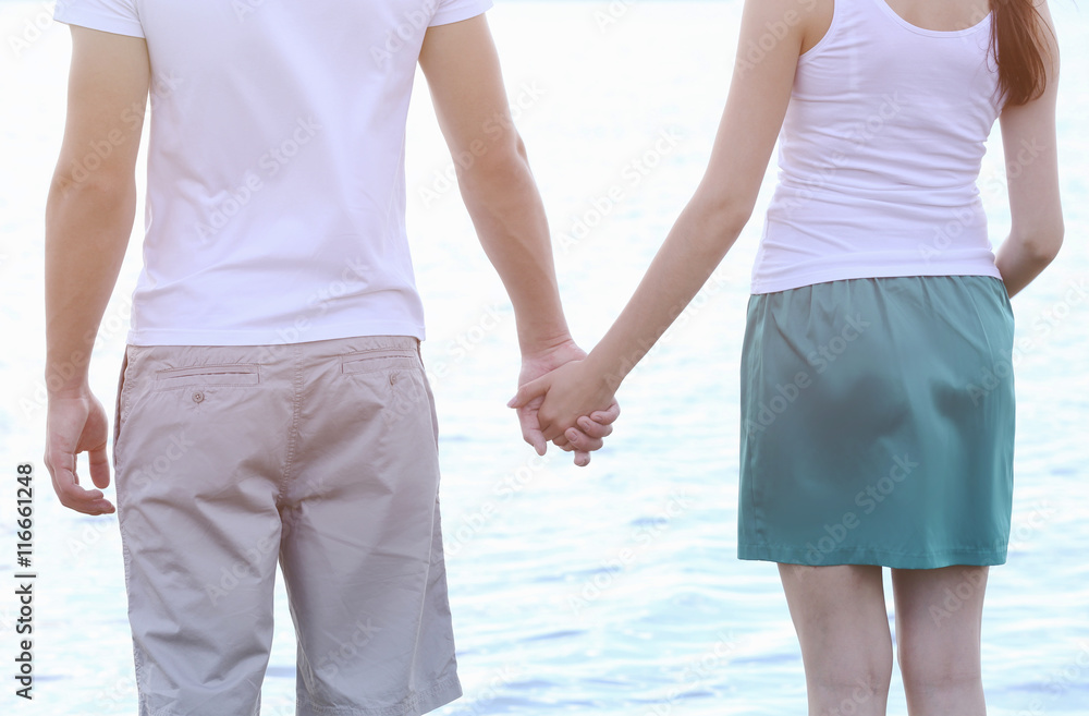Couple holding hands, close up Couple holding hands, close up