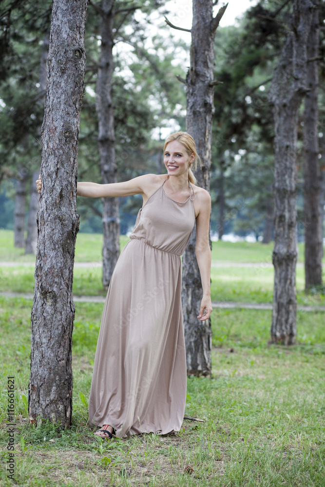 Young beautiful happy woman in park, summer outdoors Young beautiful happy woman in park, summer outdoors