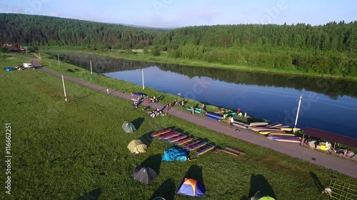 tourist camp, boat, river and forest aerial view in summer morning