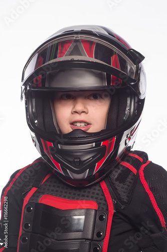 Race car or bike driver. The boy in the costume of the racer isolated on white background © sheikoevgeniya