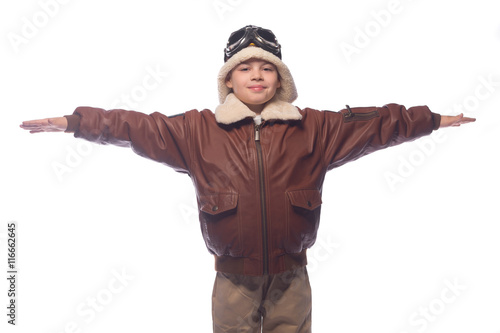 the boy is an aviator in the jacket of the pilot and in old glasses