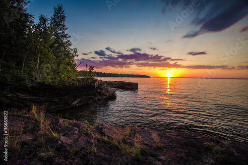 Sunset On The Shores Of Lake Superior. Sunset on the shores of Lake Superior outside of L Anse Michigan at the Point Abbaye Nature Sanctuary.