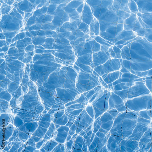 Surface of swimming pool water background