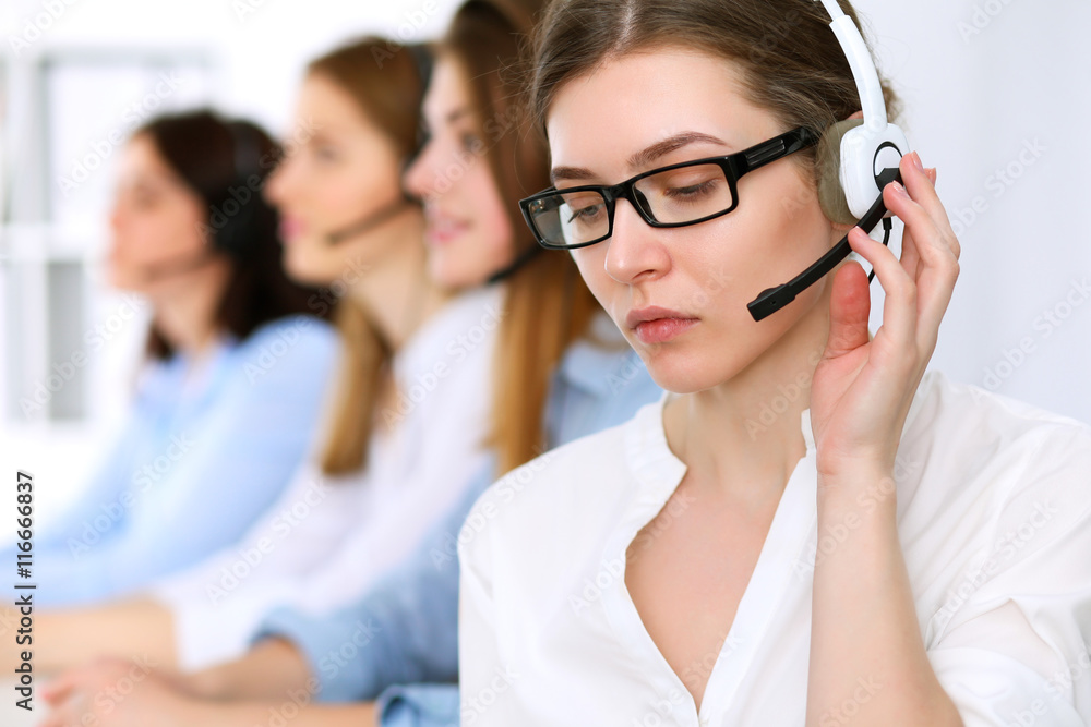 Call center operator.Young beautiful business woman in headset. Call center operator.Young beautiful business woman in headset.