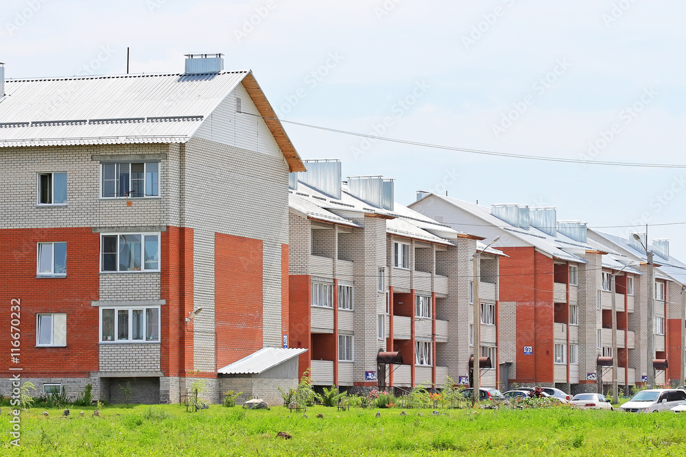 New three-storey brick apartment houses New three-storey brick apartment houses