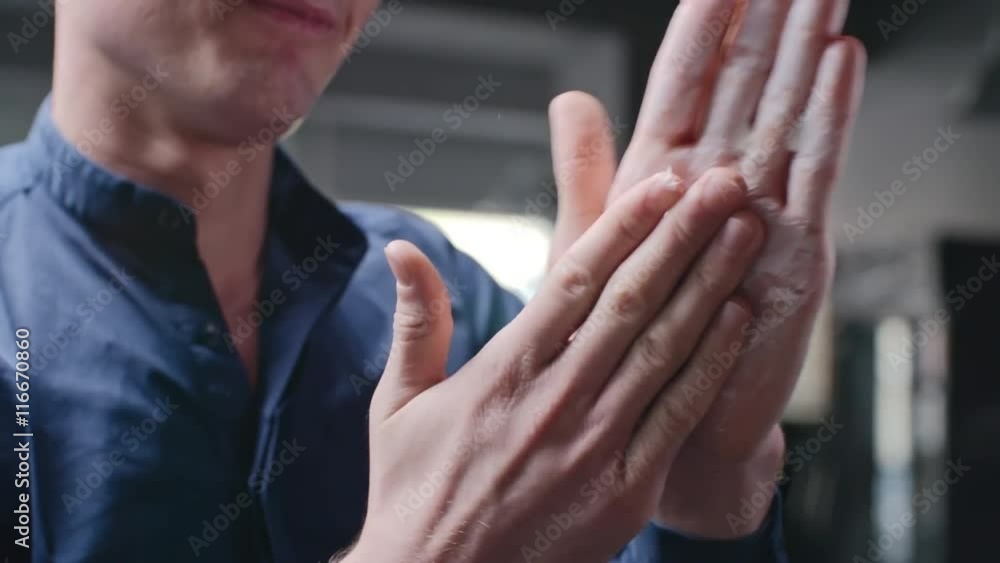 Closeup of hands of barber lathering shaving foam with his hands Closeup of hands of barber lathering shaving foam with his hands