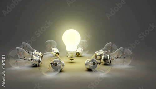 Fotografi 3d idea light bulbs, one leading light bulb while other unlit lying on ground, d