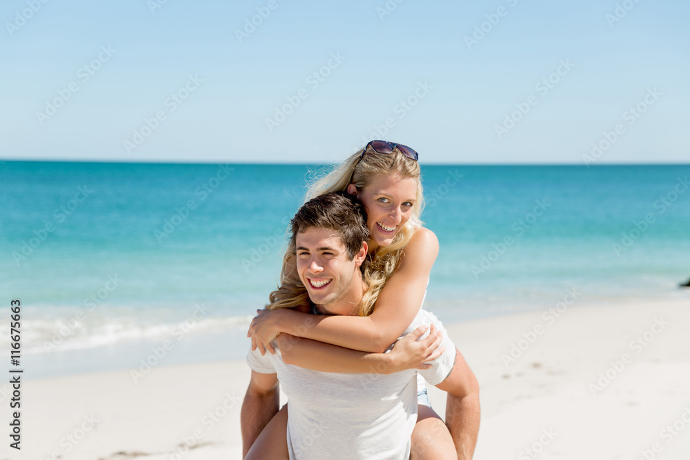 Portrait of man carrying girlfriend on his back Portrait of man carrying girlfriend on his back