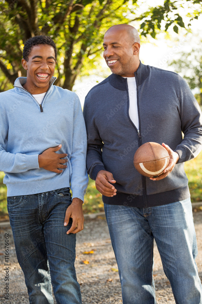 African American Father Playing Football With His Son Stock Photo ...