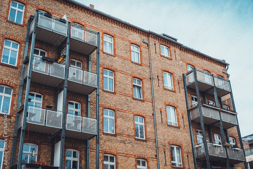 Fototapeta premium Back side of urban apartments with adjoining porch