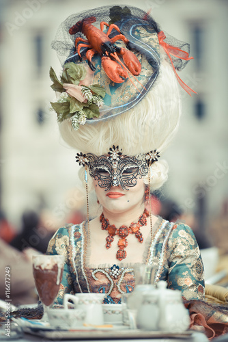Venetian masked model from the Venice Carnival in Italy