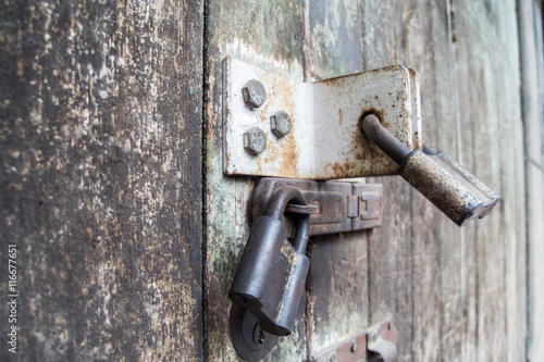 locked door on vintage old style wooden door background