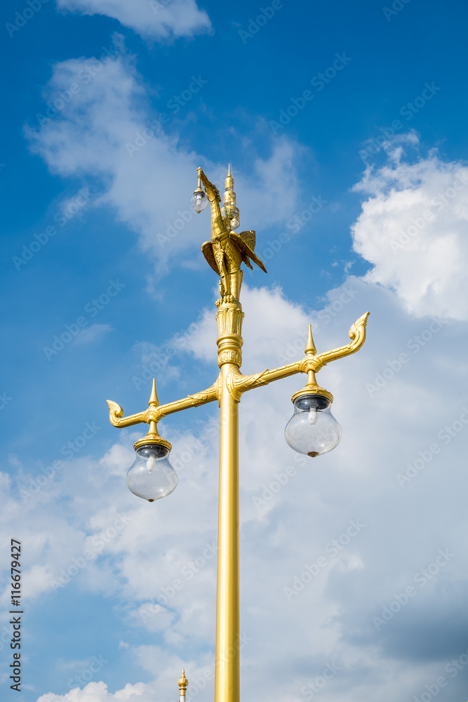 Swan statue on top pole gold and blue sky Swan statue on top pole gold and blue sky