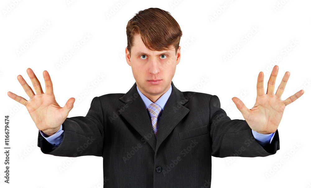 Serious business man with stopping gesture isolated on white Serious business man with stopping gesture isolated on white