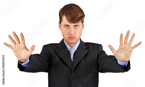 Serious business man with stopping gesture isolated on white