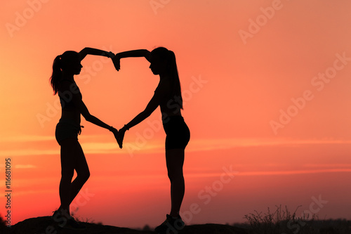 Young sporty women holding ...