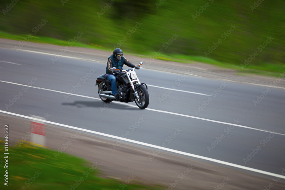 Man traveling on a classic motorcycle - chopper