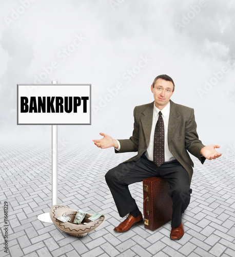 Slika na platnu Businessman begging for alms. Concept of bankruptcy