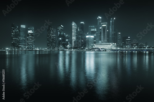 Singapore skyline at night - skyscrapers with reflections.