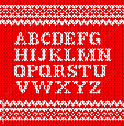 weißes gestricktes Alphabet auf rot