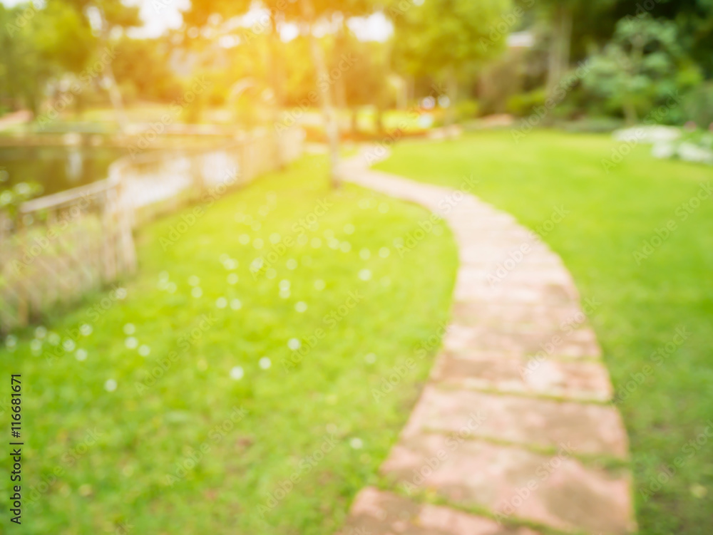 Walkway in the flowers garden blur background Stock Photo | Adobe Stock