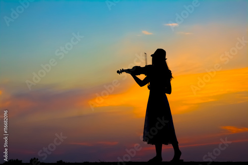 The silhouette of asian woman with the violin © AE.Panuwat Studio