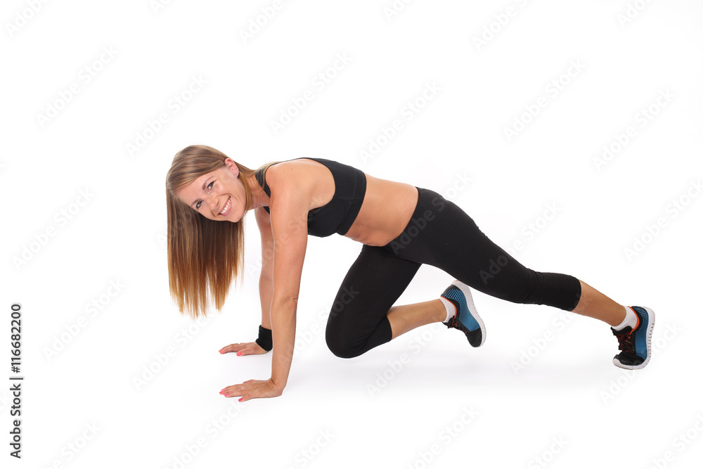 Young slim girl practicing plank