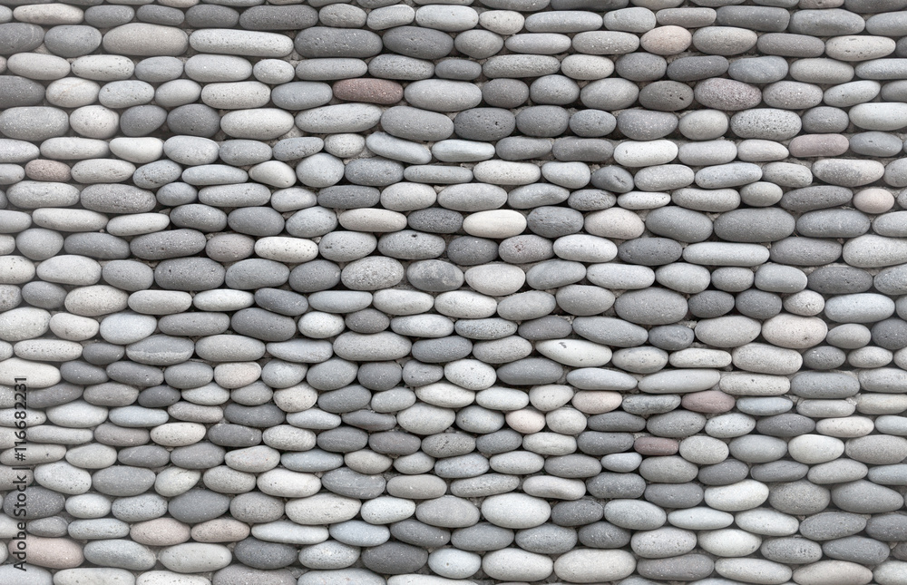 Background - wall decorated with smooth stones