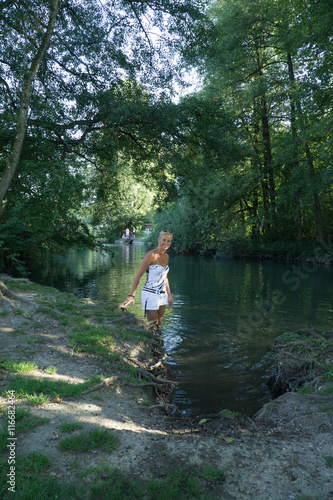 Girl taking a bath in a magical forrest