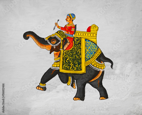 Traditional mural - image of maharaja of riding on an elephant. photo