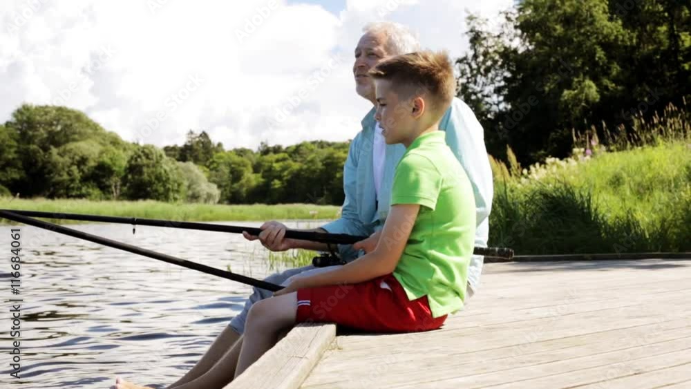 grandfather and grandson fishing on river berth 15 grandfather and grandson fishing on river berth 15