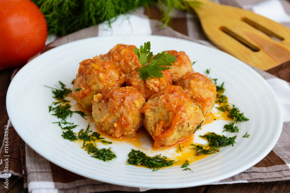 Meat balls on a white plate with greens. Meat balls on a white plate with greens.