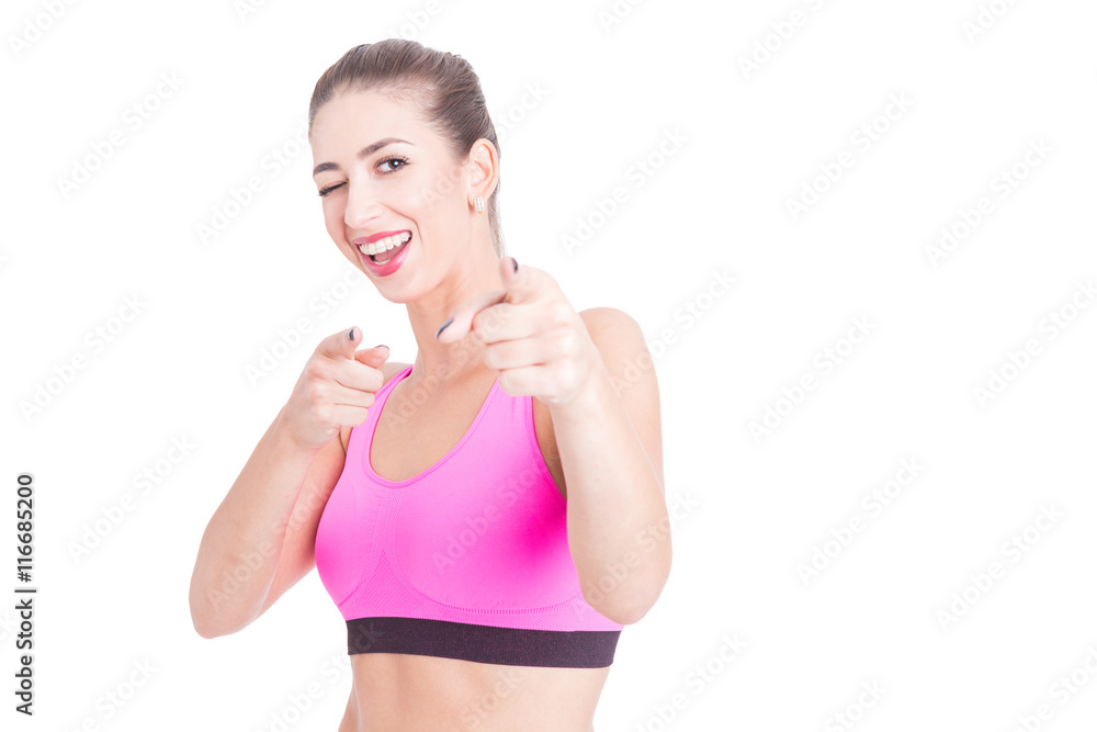 Young woman wearing sport pink bustier winking Young woman wearing sport pink bustier winking