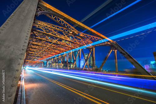 blurred light trails at waibaidu bridge,shanghai china. © kalafoto