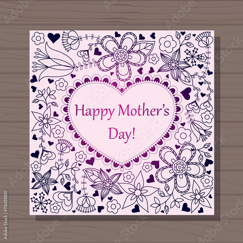 Happy mothers dat card with heart on wooden background