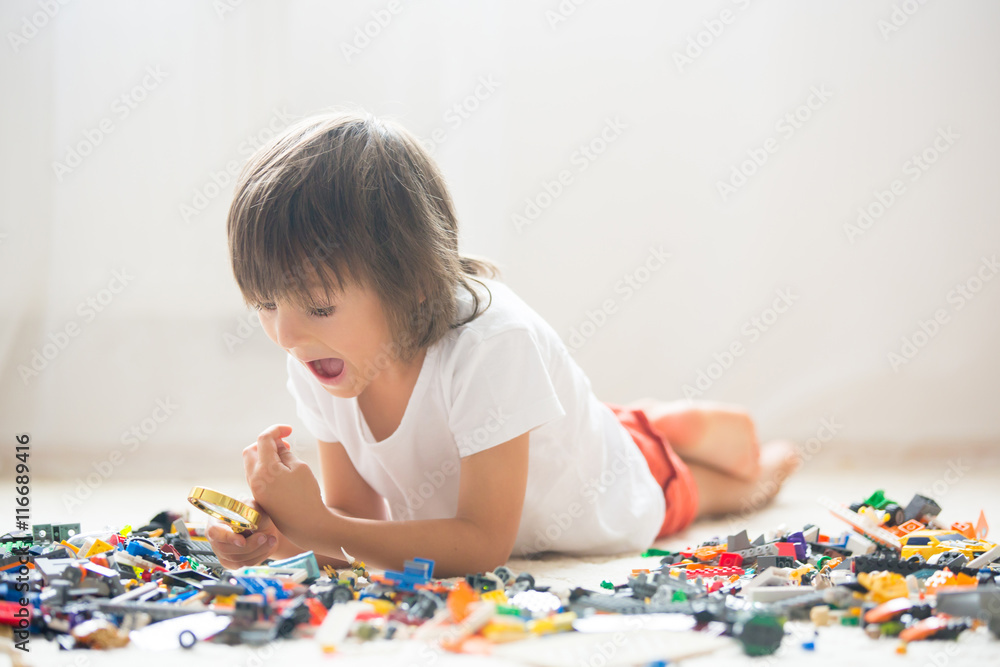 Cute little preschool children, boy brothers, playing at home wi Cute little preschool children, boy brothers, playing at home wi