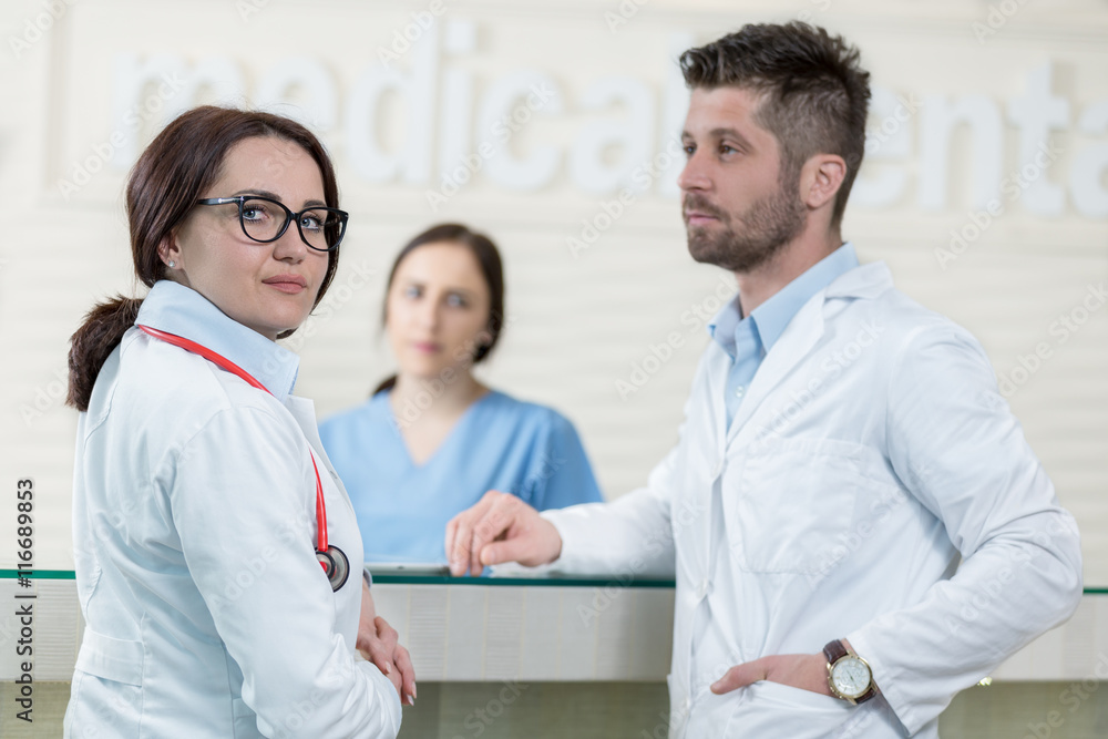 Medical Staff Having Discussion In Modern Hospital Corridor Medical Staff Having Discussion In Modern Hospital Corridor