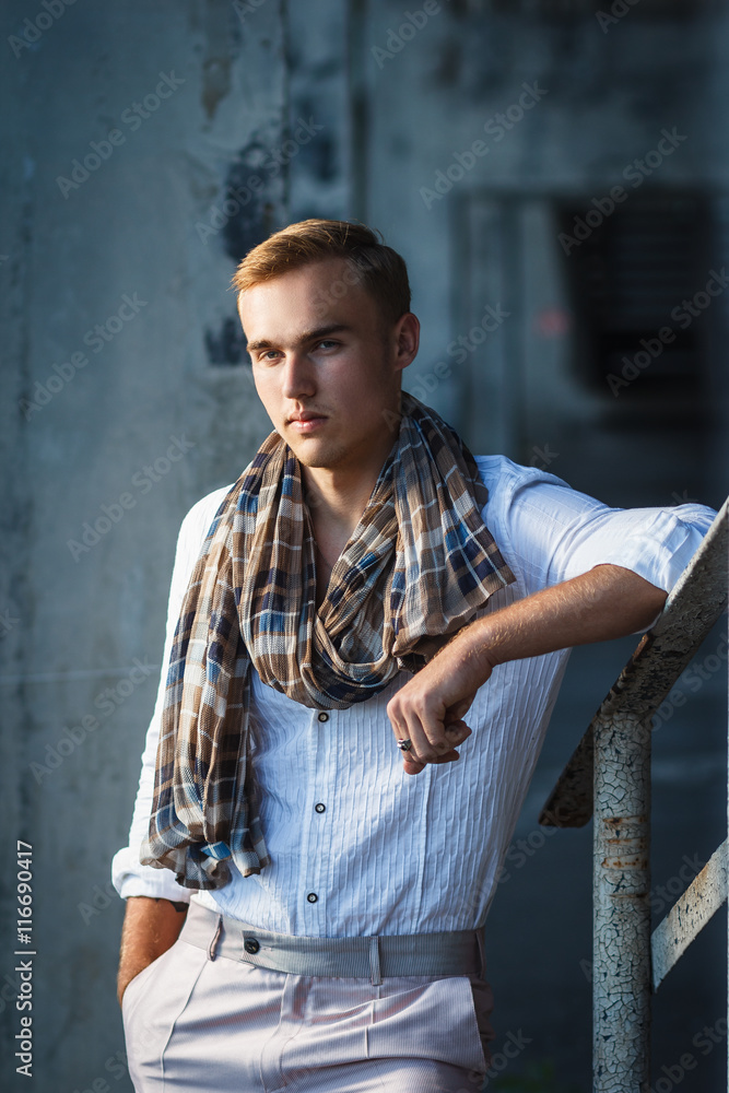 Handsome young man outdoor fashion shoot. Concept: beauty Handsome young man outdoor fashion shoot. Concept: beauty