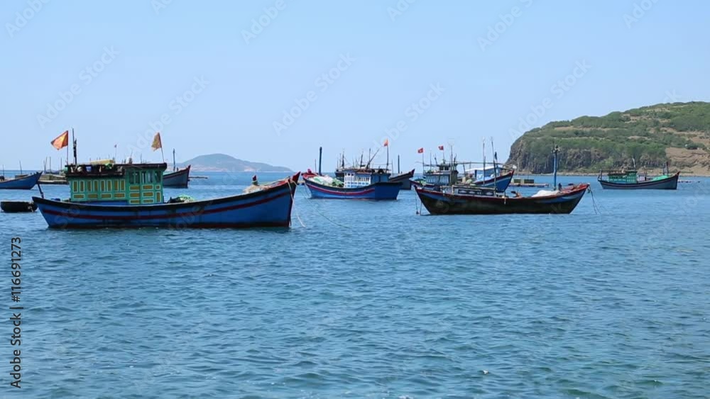 fishing boats in the Bay near the shore fishing boats in the Bay near the shore