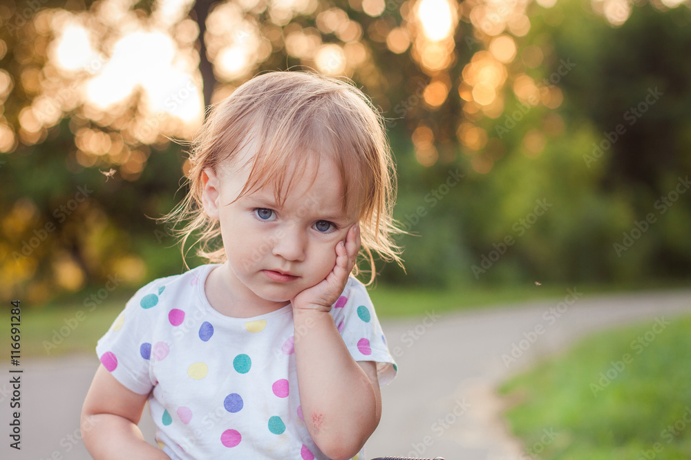Portrait of sad serious baby