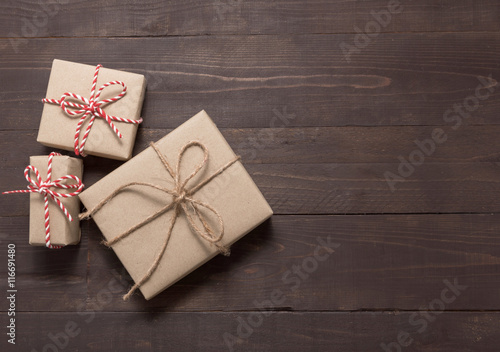 Gift boxes are on the wooden background with empty space